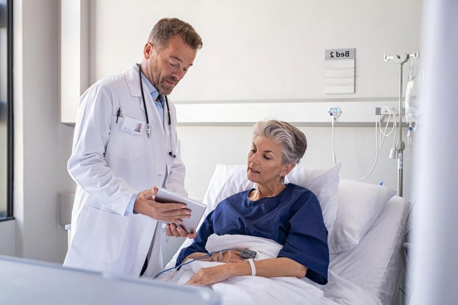 Doctor discussing digestive treatment options with a patient in a Dubai hospital ward